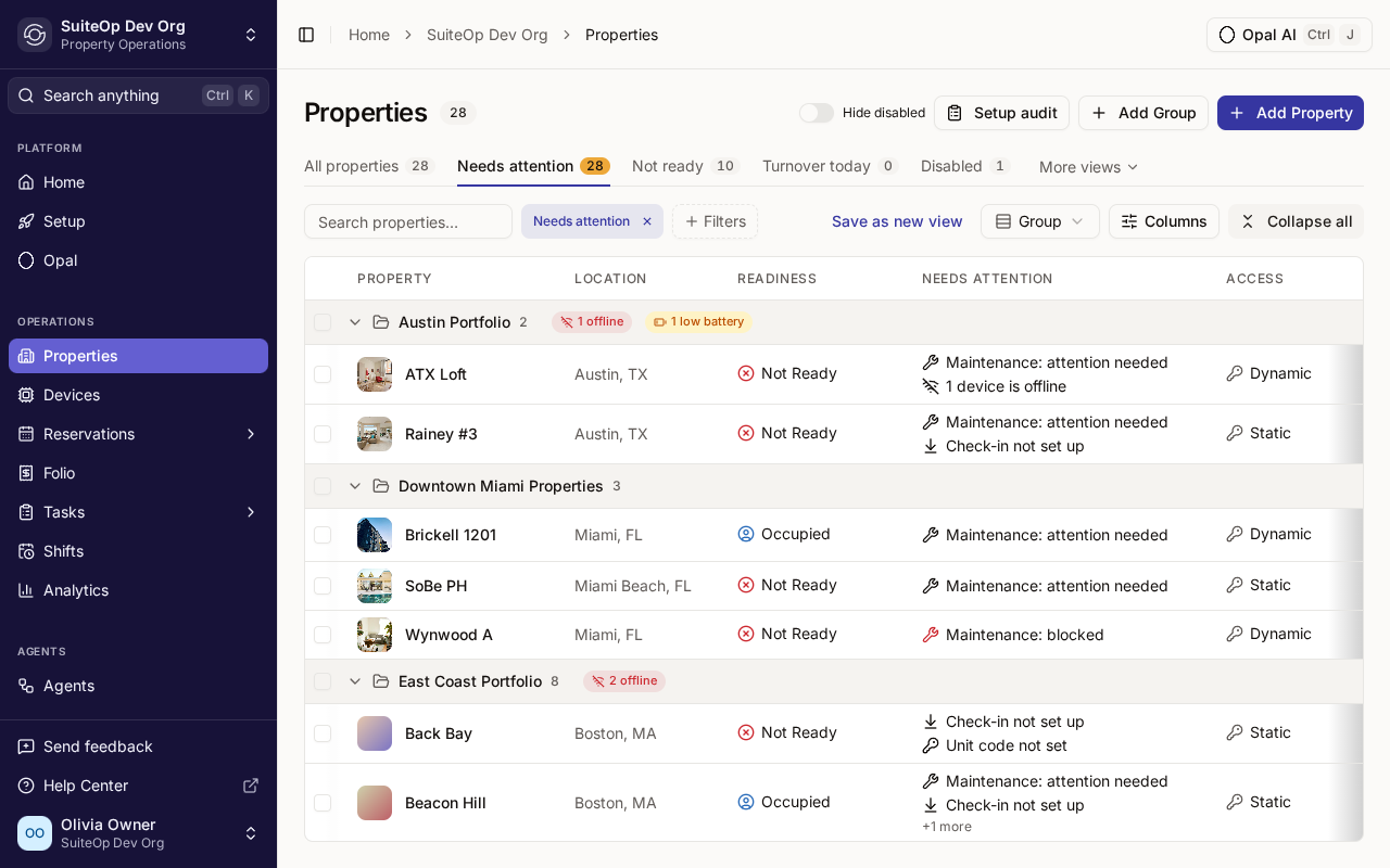 The Properties list on the Needs attention tab, with Back Bay showing Check-in not set up and Unit code not set in the Needs attention column.